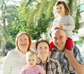 Outdoor portrait of happy multigeneration family