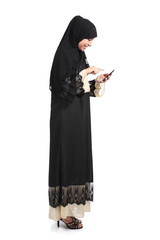 Full body of an arab saudi woman browsing a smart phone