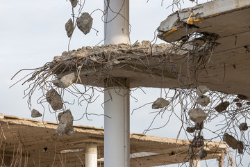 Demolition of a building with concrete floors and pillars