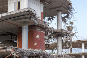 Demolition of a building with concrete floors and pillars