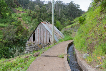 Hiking trail along an irrigation levada at Madeira