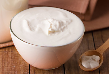 sour cream on wooden background