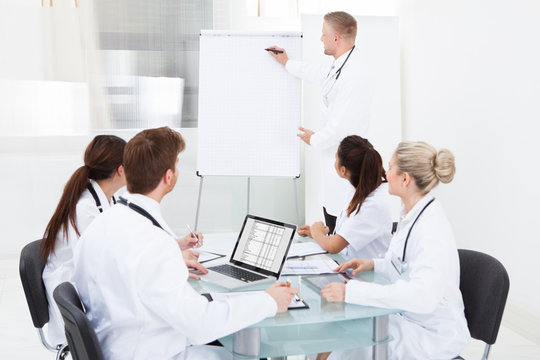 Doctor Giving Presentation To Colleagues
