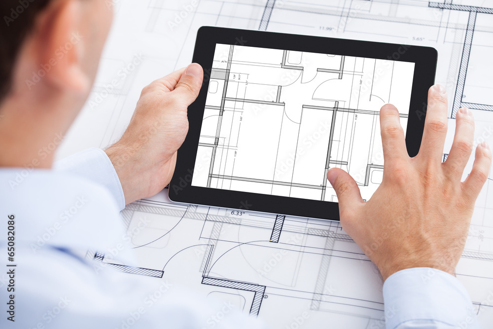 Poster Architect Analyzing Blueprint On Digital Tablet