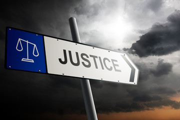 Obraz premium Justice direction. Blue traffic sign.