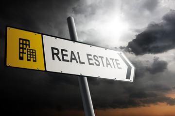 Real Estate direction. Yellow traffic sign.
