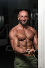 Fototapeta na wymiar Mature Bodybuilder Exercising Biceps