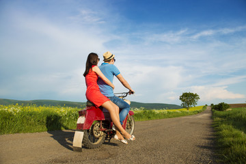 Obraz na płótnie Canvas Couple on motorbike
