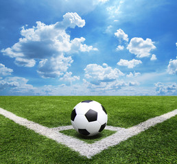 Football and soccer field grass stadium Blue sky background