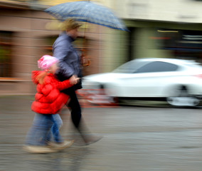 People walking down the street on rainy day