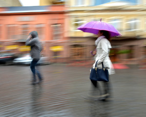 People walking down the street in rainy day