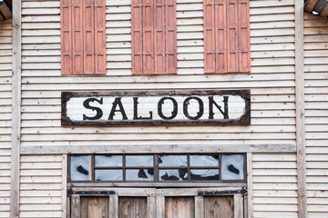 Saloon iscription on wooden building facade