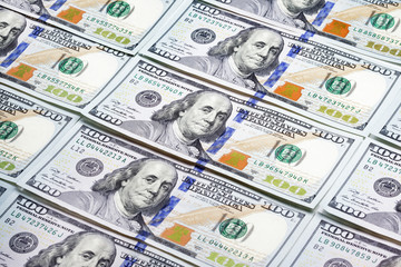 Heap of one hundred dollar banknotes as background
