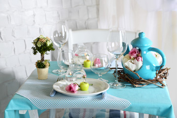Beautiful holiday Easter table setting in blue tones,