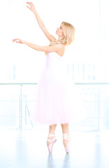 Beautiful balerina dancing in ballet class © Africa Studio