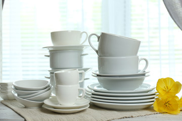 Different tableware on shelf in the interior