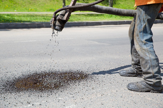 Construction Worker during Pothole Repair