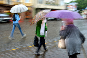 People walking down the street on rainy day