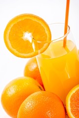 Glass of fresh orange juice, isolated on white background.