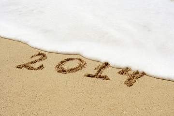 Conceptual text sand on beach