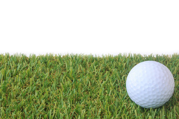 isolated golf ball on green grass over white background
