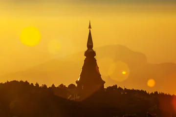 Fotobehang Silhouette of Pagoda on the top of mountain © SANCHAI