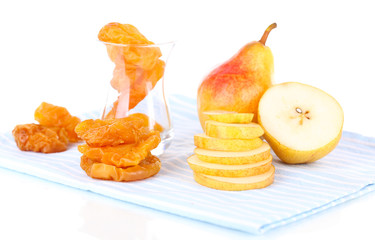 Dried pears on color napkin, isolated on white