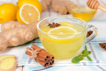 Healthy ginger tea with lemon and honey on table close-up