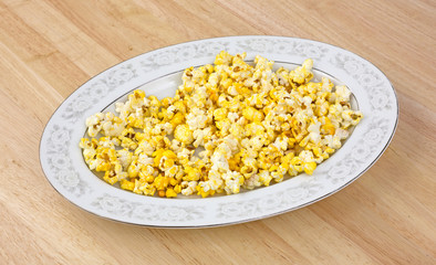 Platter of popcorn on tabletop