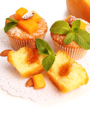 Tasty pumpkin muffins, isolated on white