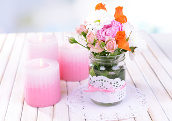 Beautiful bouquet of bright flowers in jar