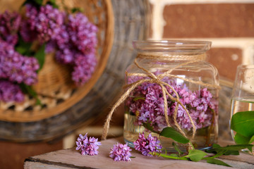 Beautiful lilac flowers in vases,