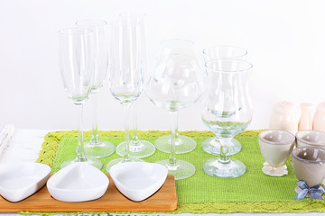 Different tableware on shelf, isolated on white