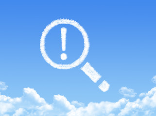magnifying glass and exclamation cloud shape