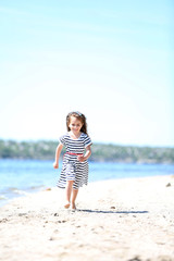 Beautiful little girl on the beach