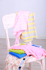 Clothes on chair on gray background