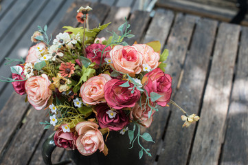 Decorative artificial flowers in vase