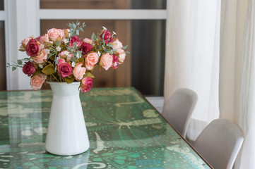 Decorative artificial flowers in vase