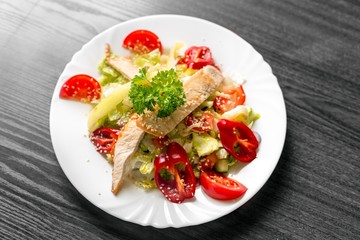 Fresh salad with chicken on white background