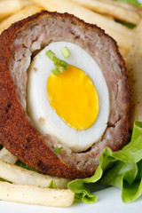 Meat stuffed eggs with french fries and lettuce macro