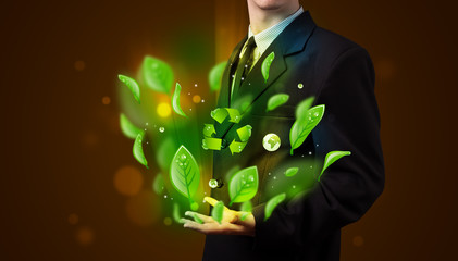 Young businessman presenting eco green leaf recycle energy conce