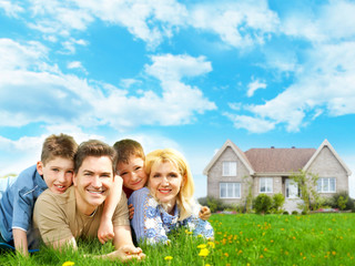 Happy family near new home.
