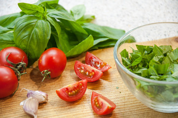 Preparing Bruschetta.ciabatta,oil, tomato, garlic, basil