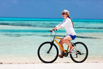 Fototapeta na wymiar Young woman biking