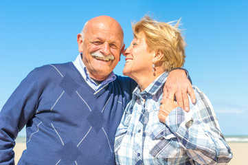 Senior couple hugging and smiling