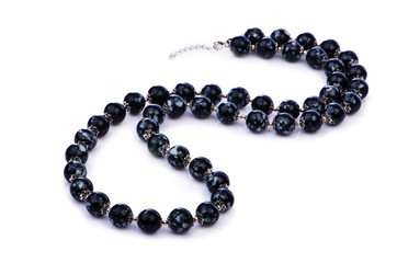Dark pearl necklace isolated on the white
