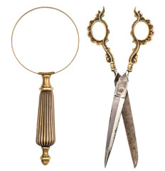 Antique magnifying glass and scissors isolated on white
