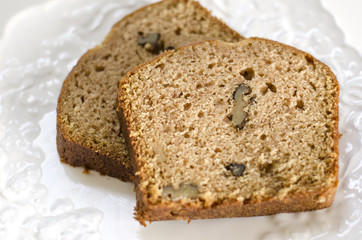 Walnut bread slices on a white plate