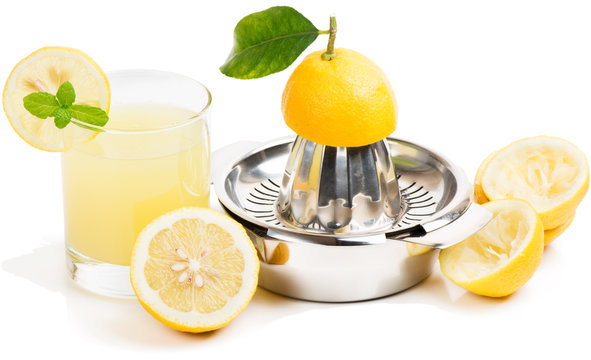 lemon juice, squeezer and fruits