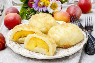 Peach in pastry, popular austrian dish. Garden party table